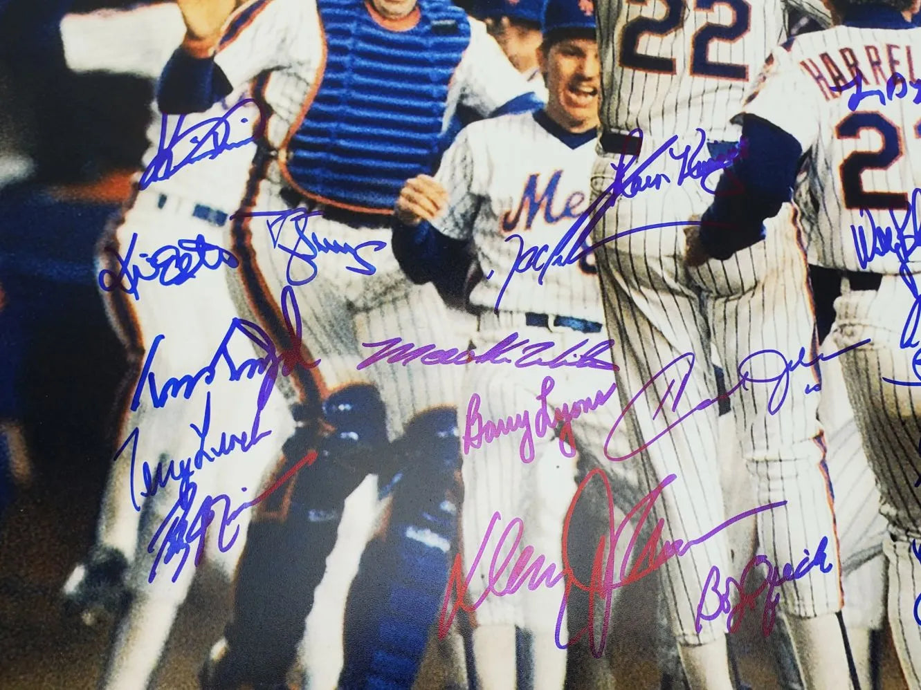 1986 Mets WS Champs Team Signed (JSA) – Doc Gooden, Darryl Strawberry, Ray Knight, Mookie Wilson & Others (26 Total) Signed 16×20 Photo (JSA COA)